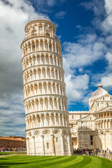 Fototapeta na wymiar The Leaning Tower of Pisa in Square of Miracles at sunny day, Tuscany region, Italy.