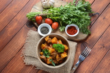 Traditional homemade Hungarian beef meat stew, Goulash with potatoes, carrots , tomatoes, broccoli in a bowl