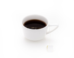 Obraz na płótnie Canvas black tea in white cup on isolated white background