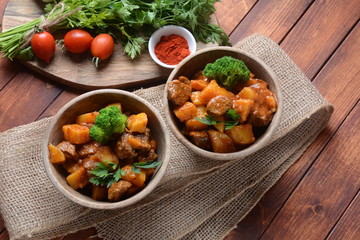 Traditional homemade Hungarian beef meat stew, Goulash with potatoes, carrots , tomatoes, broccoli in a bowl