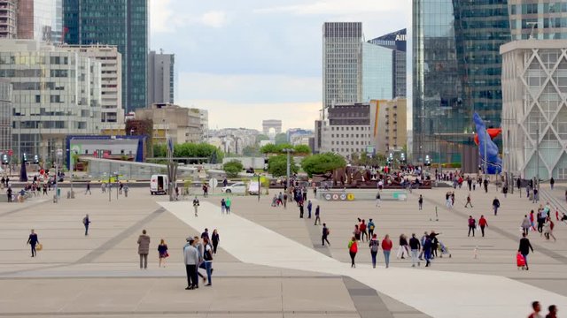 La Defense business district in Paris France, time lapse of La D&eacute;fense with its esplanade and  skyscrapers, it is Europe's largest purpose-built business district