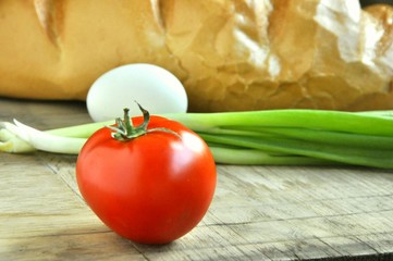 red tomato on food background