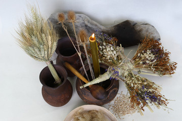 An amulet of dolls holding an angel from hay and a dry flower of handmade. Dry shoots, wheat, rye....