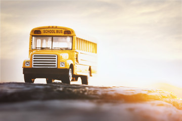 Yellow school bus toy model.Back to school /Education concept background.
