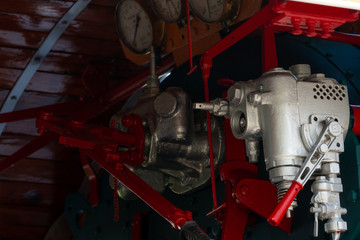 Closeup control valve of steam locomotive. Directional valves allow steam to flow through the steam locomotive engine drive system. Railway transportation industry. The train operated on furnace oil.