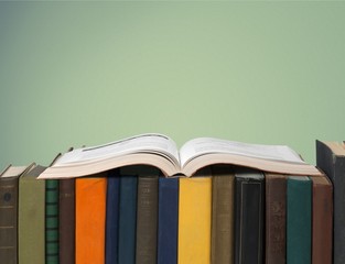 Books collection on dark background with copy