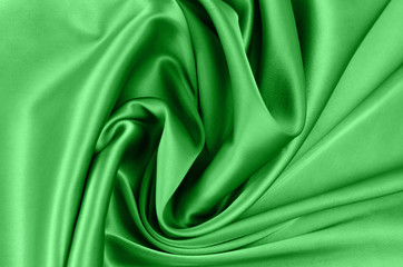 Background from satin fabric of green  color.