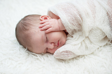 a newborn baby is sleeping