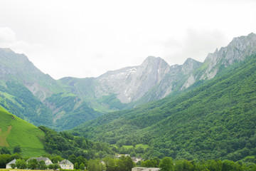 Fototapeta na wymiar Green Landscape of Pirineos french part beautiful mountains and green colors cloudy day