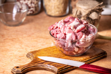 Meat pieces in a glass bowl.