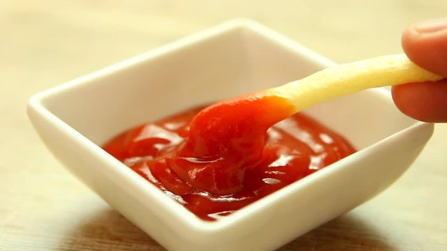 Man eating potato French fried with tomato sauce, Chiangmai Thailand
