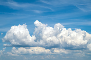 Naklejka na ściany i meble Blue sky with white and gray clouds.