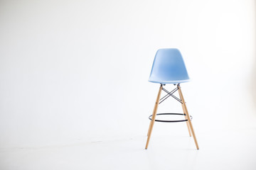 Blue wooden chairs for the legs on a white background. White cyclorama in the studio. Isolated.