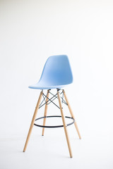Blue wooden chairs for the legs on a white background. White cyclorama in the studio. Isolated.