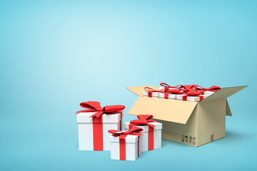 3d rendering of gift boxes in carton box on blue background.