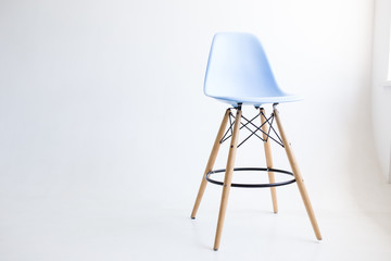 Blue wooden chairs for the legs on a white background. White cyclorama in the studio. Isolated.