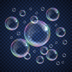 Realistic floating soap bubbles with rainbow reflection on transparent background. Design element for advertising booklet, flyer or poster