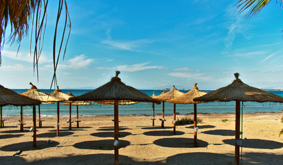 beach with chairs and umbrellas
