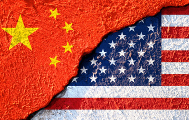 Closeup crack of USA flag and China flag .It is symbol of tariff trade war crisis between United...
