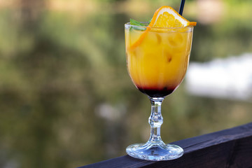 glass of juice on wooden table