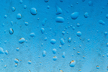 Raindrops on car windshield in the morning