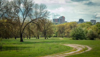Obraz premium Urban construction against the backdrop of nature