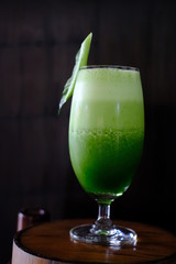 healthy kale smoothie on wood table