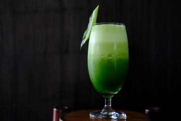 healthy kale smoothie on wood table