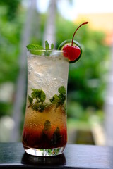 red cocktail in glass