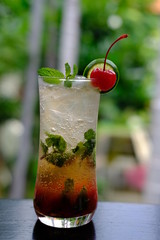 red cocktail in glass