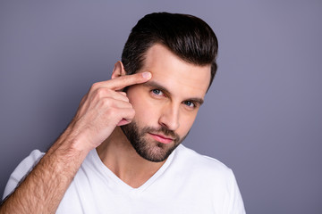 Close up photo amazing he him his macho perfect appearance touch hand temple not sure good quality stylist work not smiling look mirror bath shower wear casual white t-shirt isolated grey background