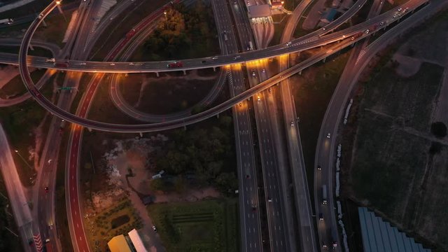 Aerial view and Top view. Traffic of expressways at night, motorways and highways