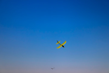 Children's airplane in the blue sky
