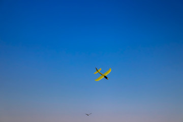 Children's airplane in the blue sky