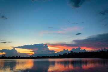 Naklejka na ściany i meble Sunset with reflection on the lake