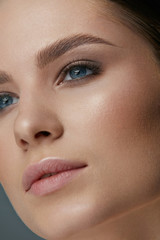 Beauty makeup. Woman face with eyes and eyebrows make-up