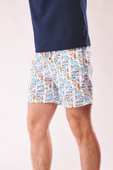 Man in white swiming shorts with fish print. White background