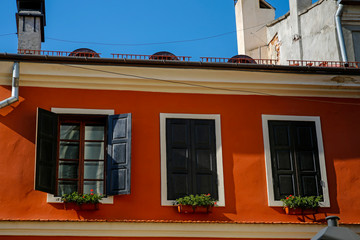 colorful building with wooden windows