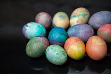 Group of easter painted eggs on black background