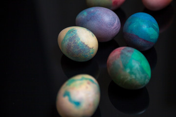 Group of easter painted eggs on black background