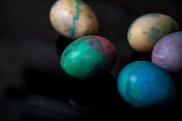 Group of easter painted eggs on black background