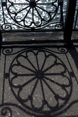 Shadow of  round design on asphalt