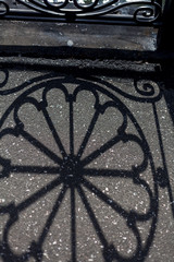 Shadow of  round design on asphalt