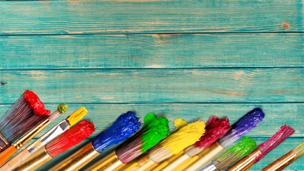 Row of artist paint brushes  on background