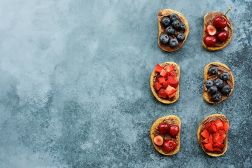 Toasts with chocolate spread and blueberries. Delicious breakfast or snack
