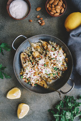  Eggplants, Aubergines Stuffed with bulgur, raisins, almonds and yogurt served on pan.  Top view, copy space