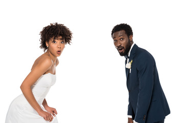 surprised african american bride and bridegroom isolate on white