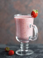 Strawberry milkshake in a glass mug