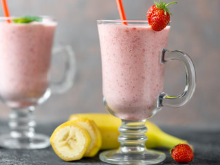 Strawberry banana smoothie in a glass jar. Healthy and healthy summer Breakfast