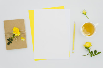 Flat lay paper mockup with floral elements